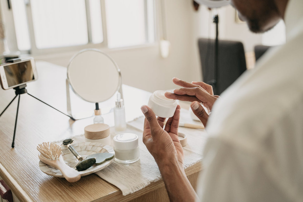 Woman applying facial cream