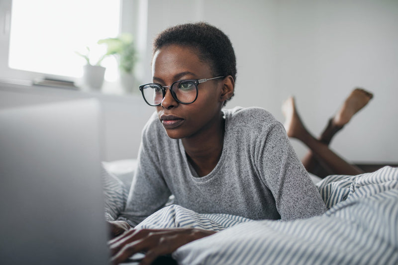 Middle Age Woman Researching on Laptop