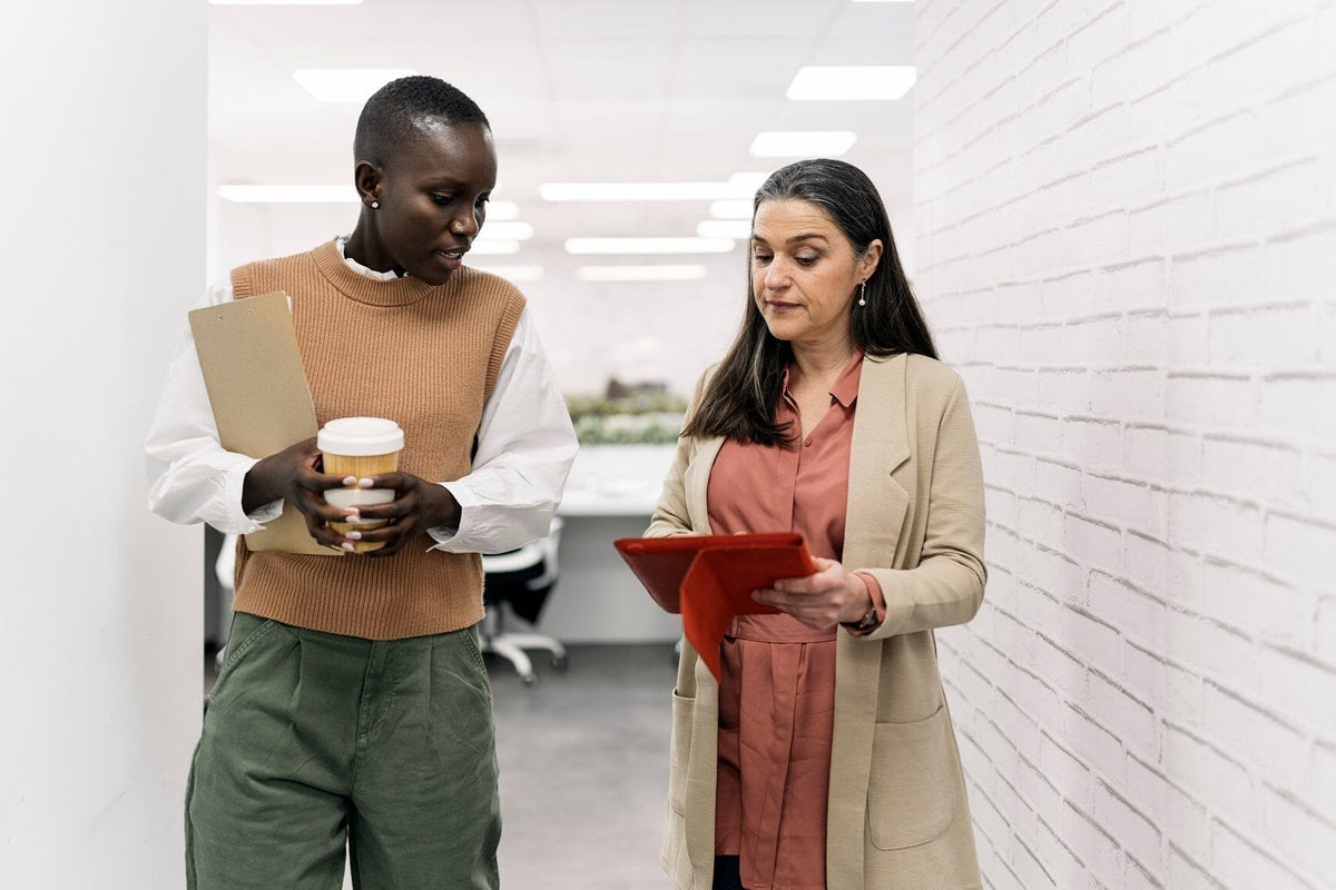 Two women in a work setting