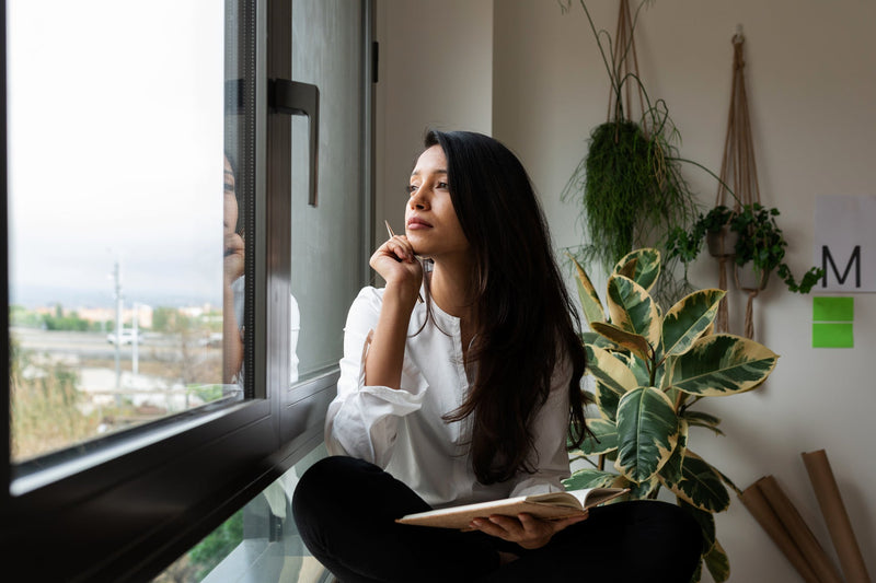 Woman looking out the window