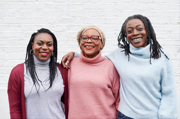 Three women smiling