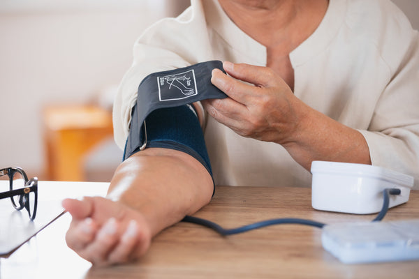Woman taking blood pressure