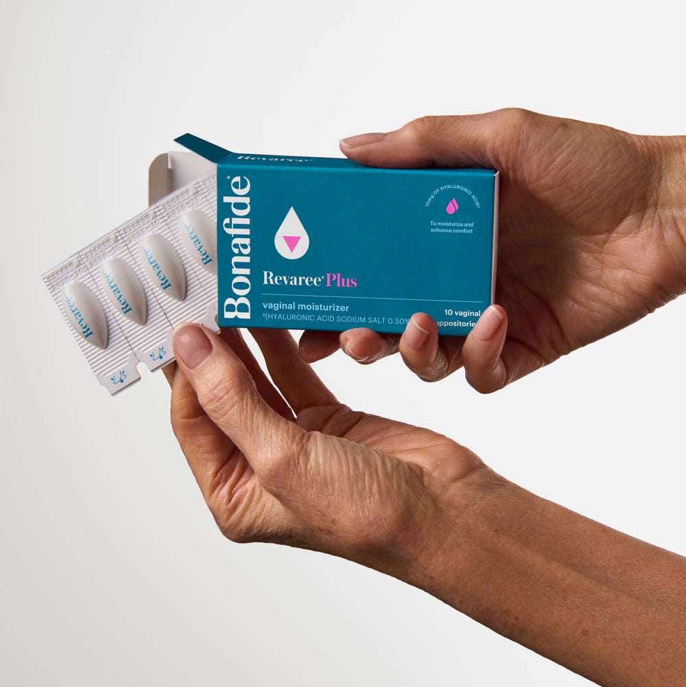 Hands holding Bonafide Revaree Plus vaginal moisturizer box and blister pack.