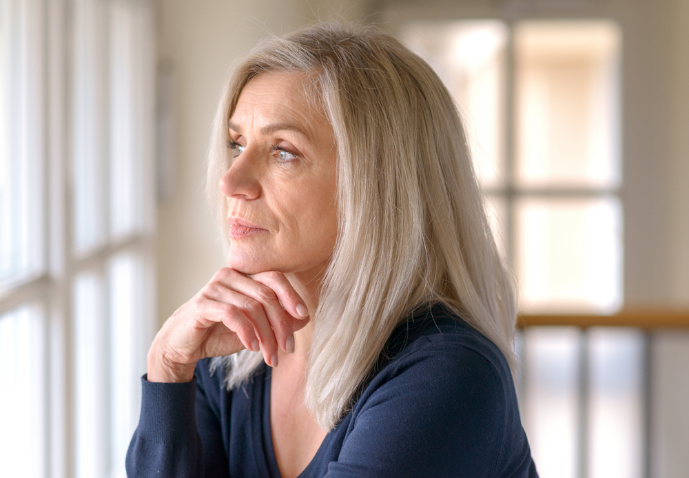 Woman looking out window