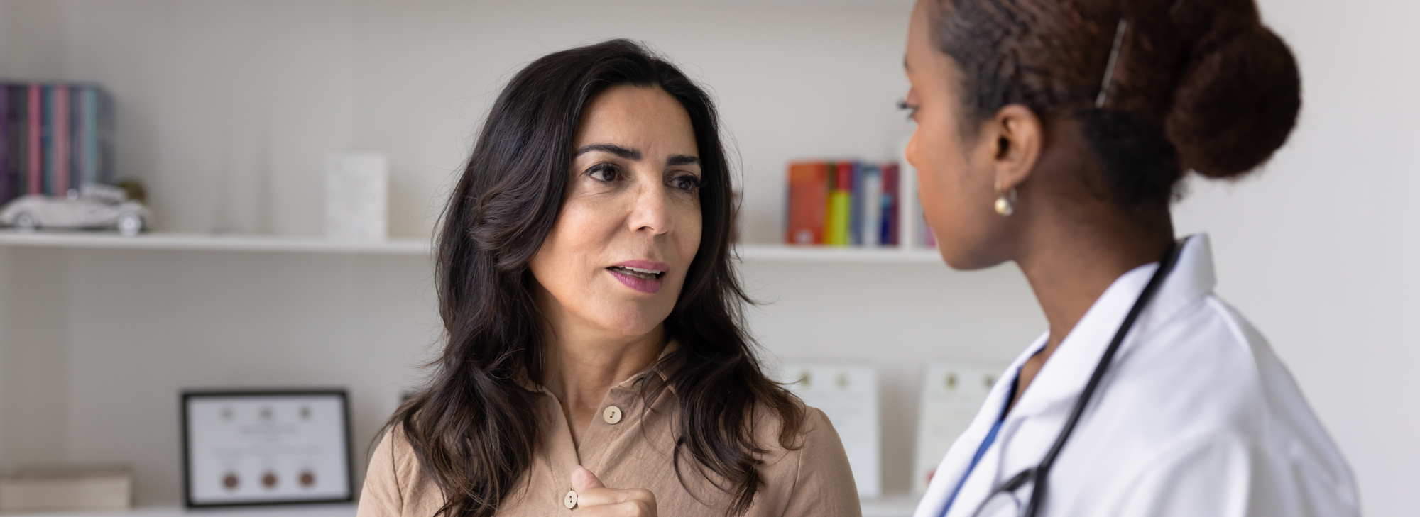Woman talking with health care practitioner