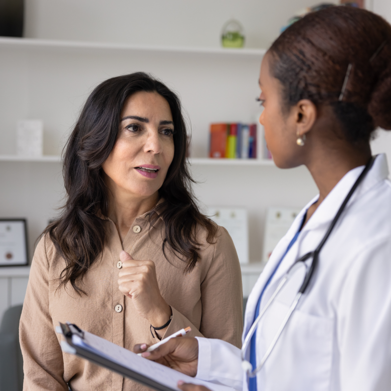 Woman talking with healthcare practitioner